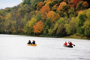 Colorful canoeists and fall colors on the St Croix 